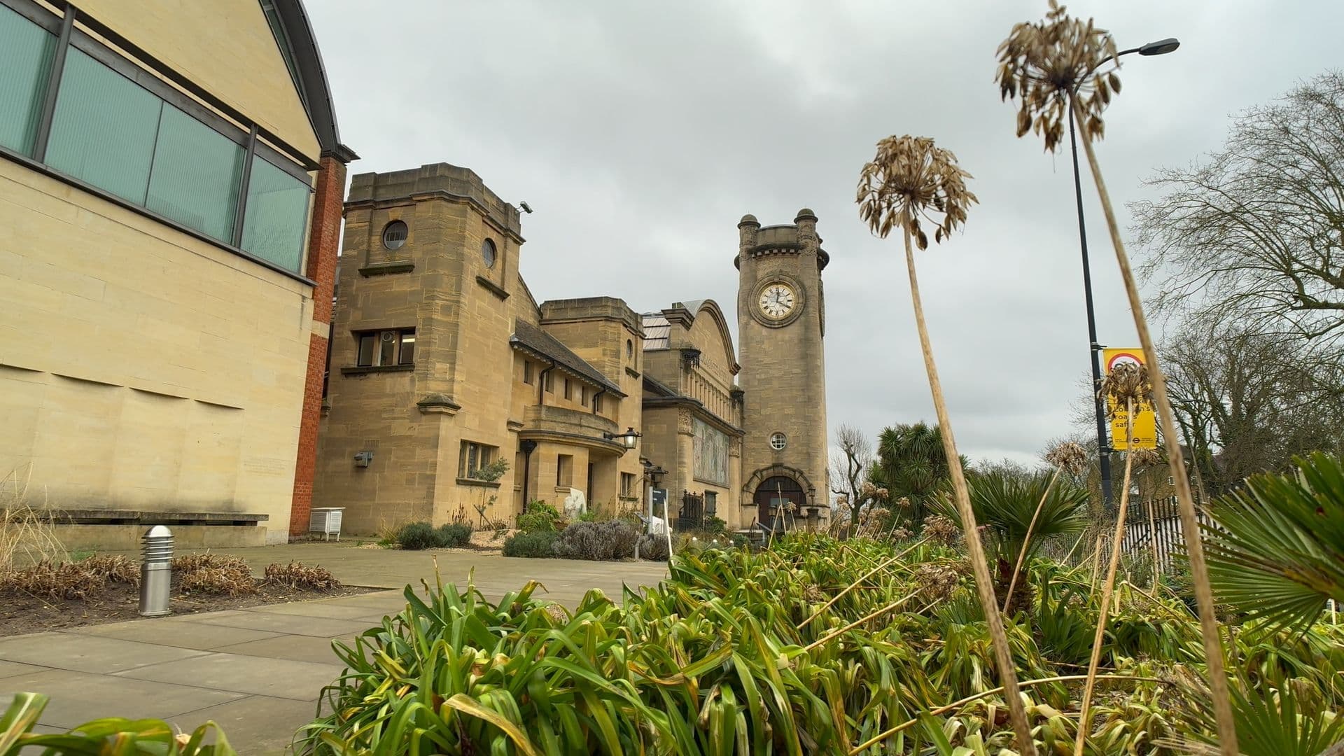 A wide shot of building with a clocktower.